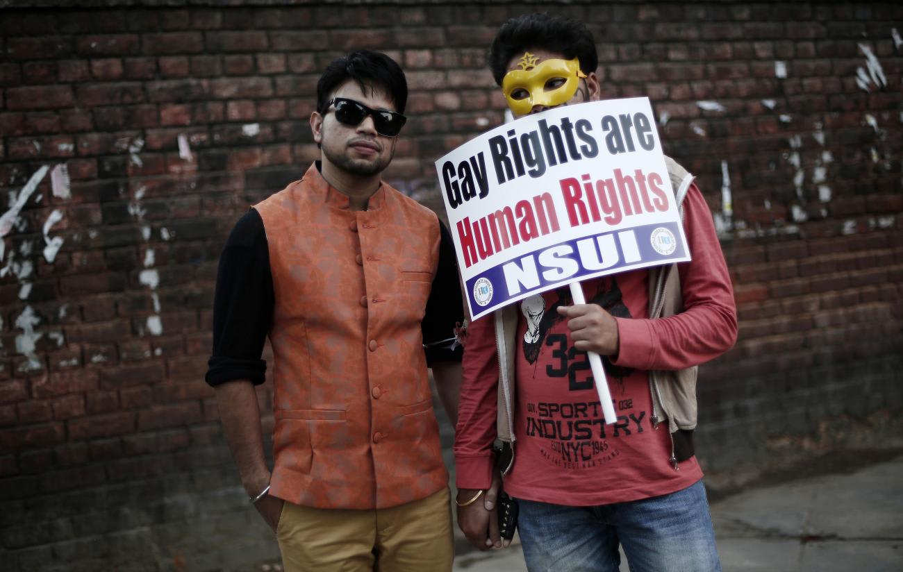 Participants hold a placard during Delhi Queer Pride Parade, an event promoting gay, lesbian, bisexual and transgender rights, in New Delhi, India, on November 30, 2014.