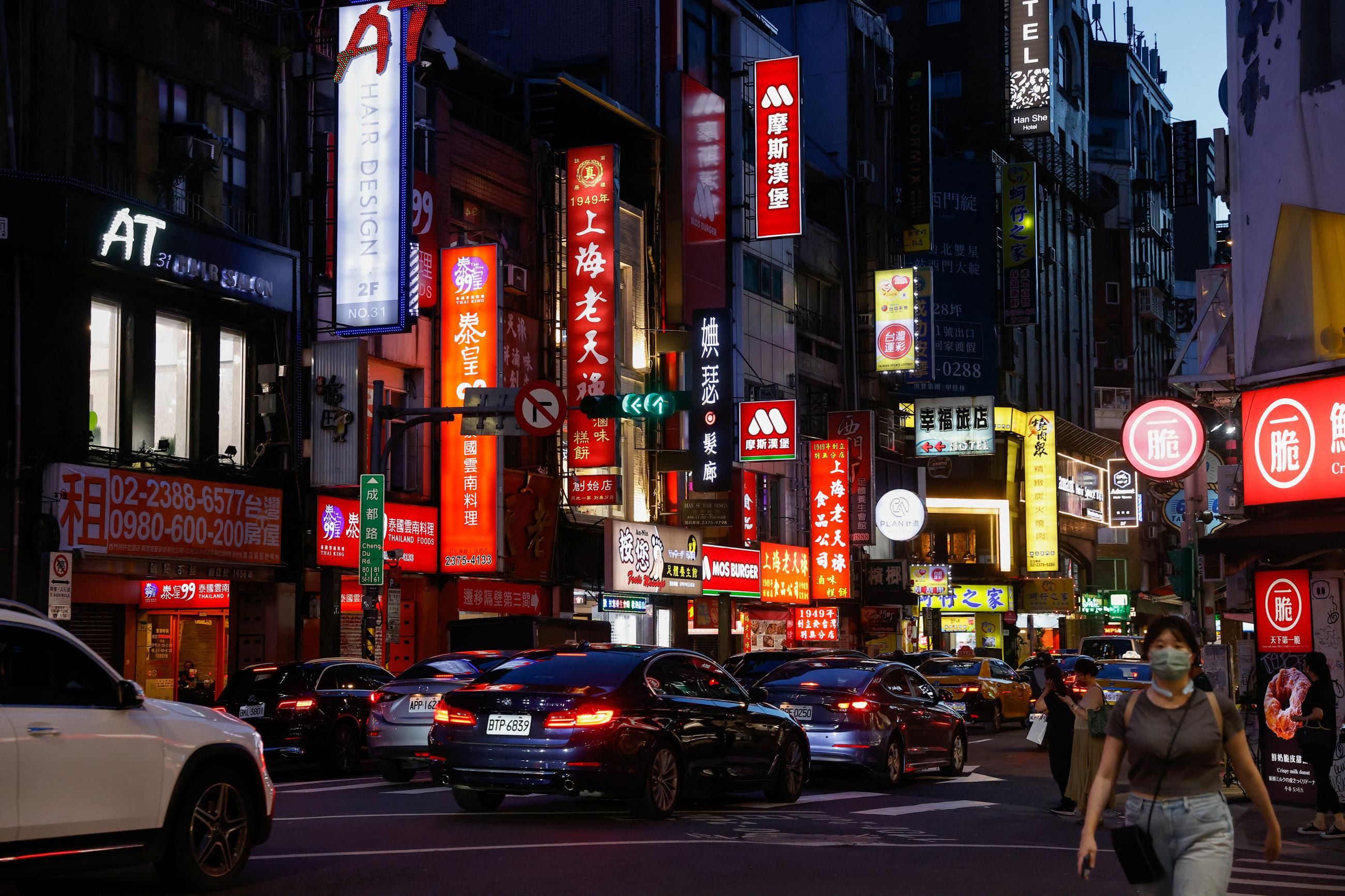 People walk on the street in Taipei, Taiwan, July 25, 2023.