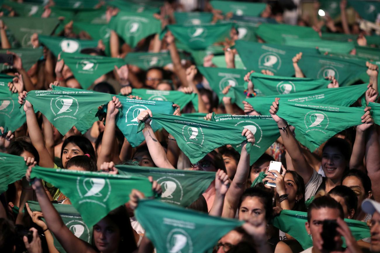 Activists hold green handkerchiefs, symbolizing the abortion rights movement, during a rally to legalize abortion.