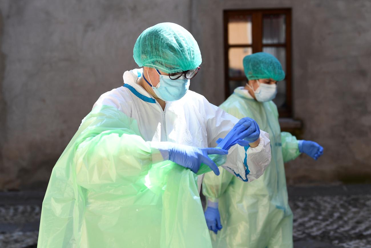 Doctors prepare for a home visit as the spread of COVID-19 continues.