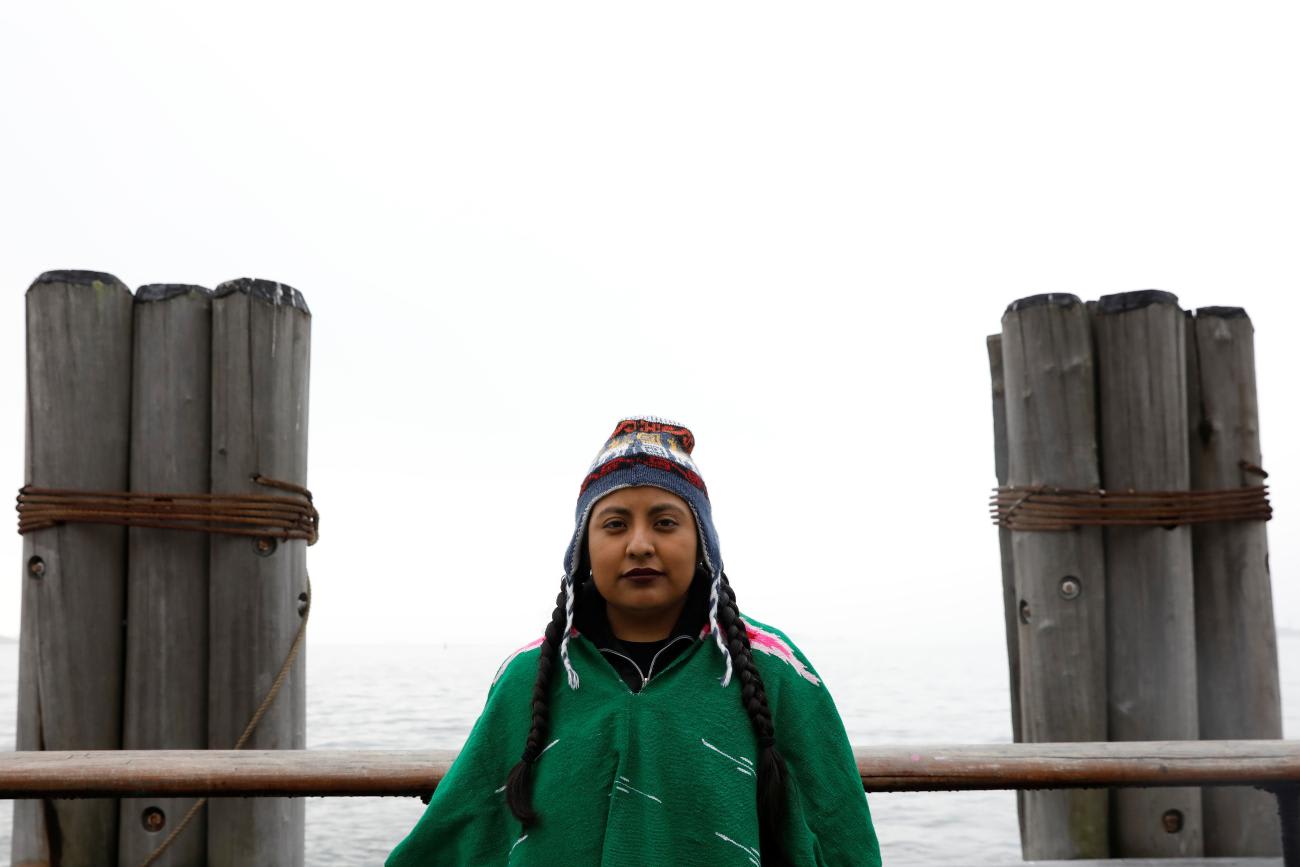 Cata Santiago, a DACA recipient who migrated with her parents from Mexico, poses for a photo in Battery Park before starting the 'Walk to Stay Home.'