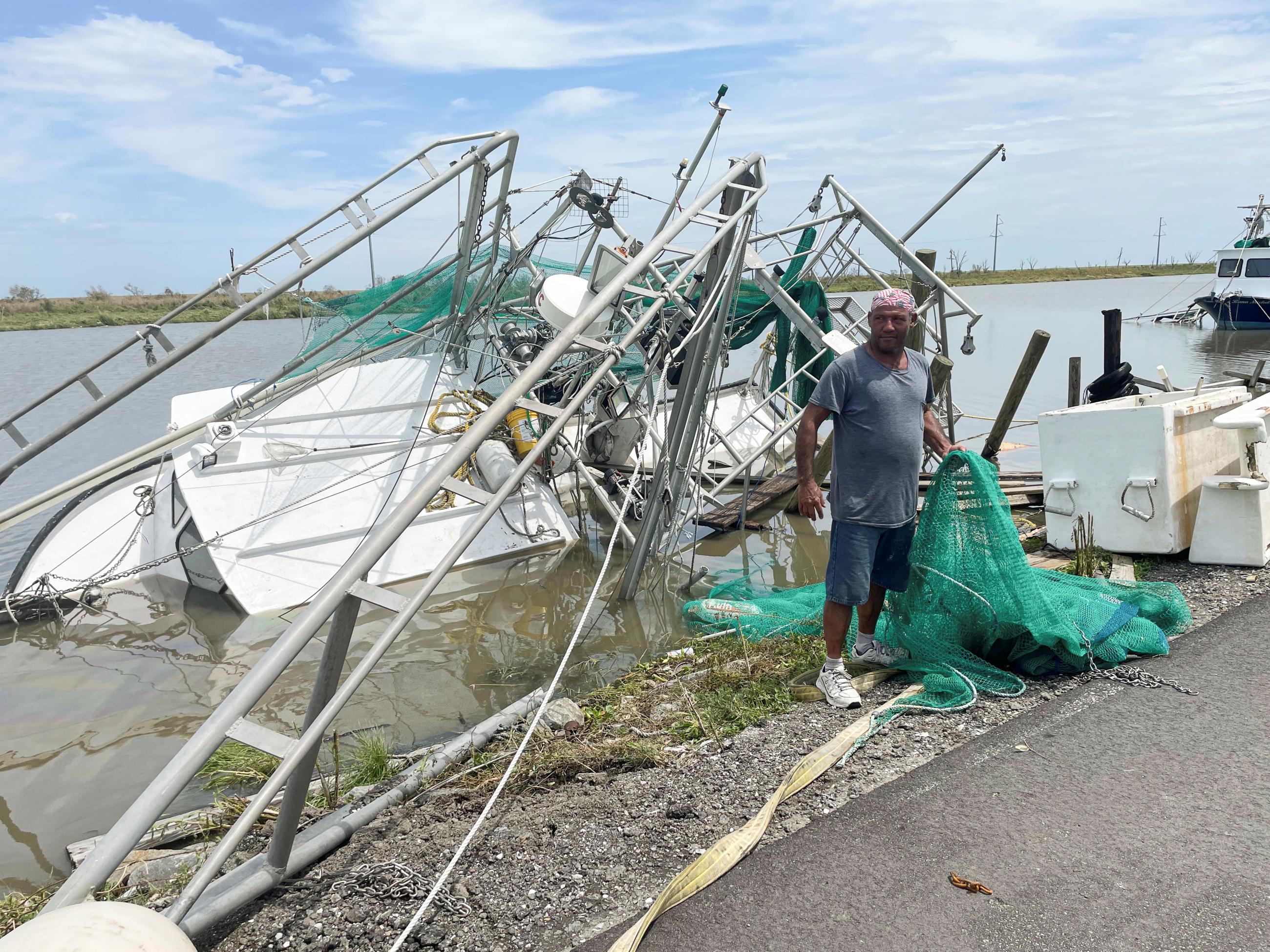 A man surveys the damage to homes and shrimp boats after&nbsp;Hurricane&nbsp;Ida made landfall.