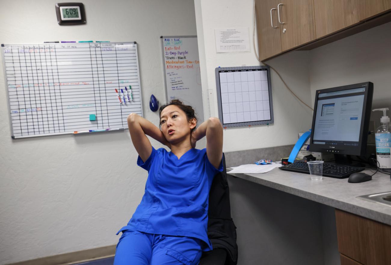 Shelly Tien, MD, sits at her desk after finishing the last abortion of the day at the Trust Women clinic.