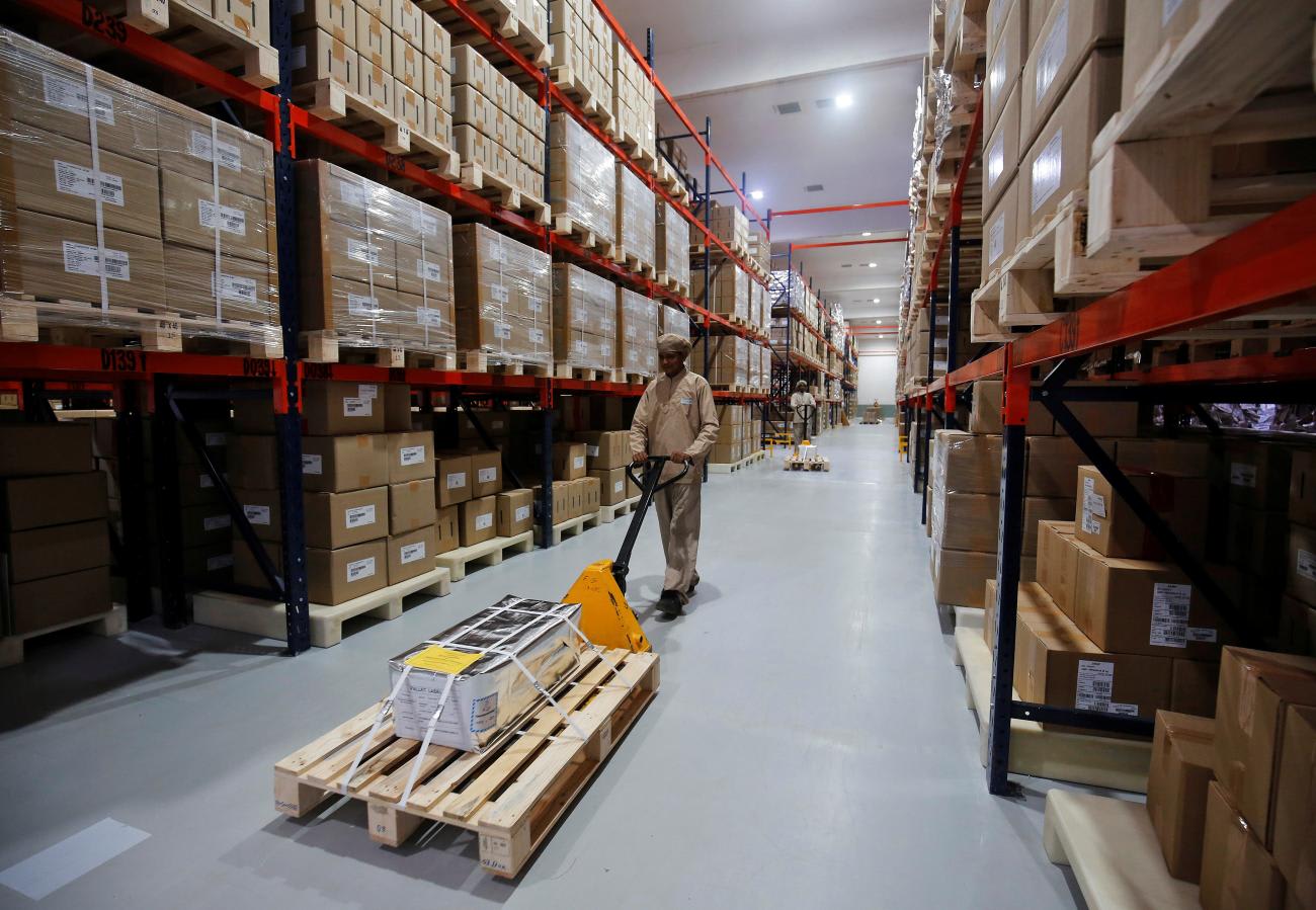 An employee works inside the warehouse of Alembic Pharmaceutical Limited's plant.