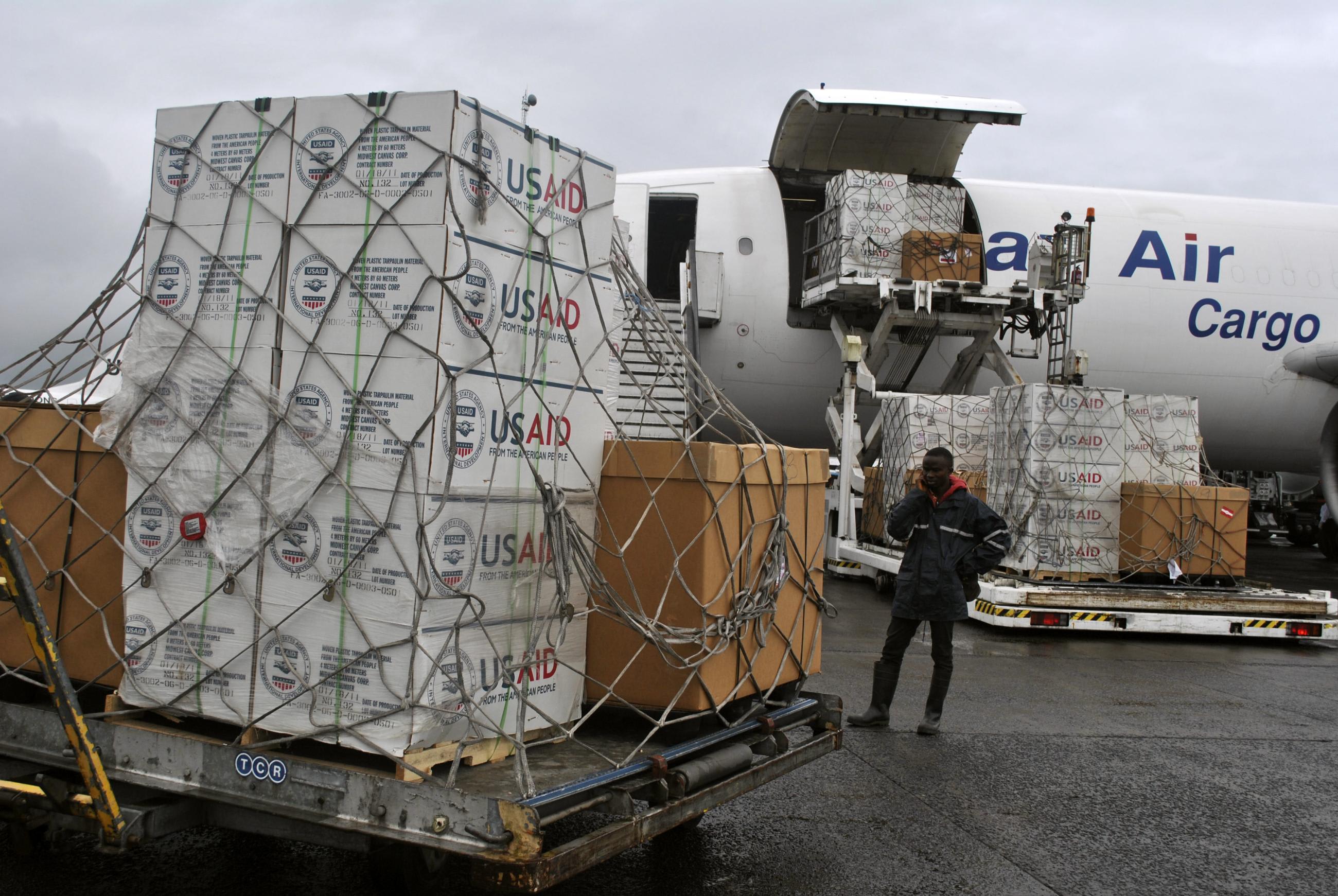 A worker is seen as the first shipment of USAID medical equipment to fight against Ebola is offloaded at the Roberts International Airport, in Monrovia, Liberia, on August 24, 2014.