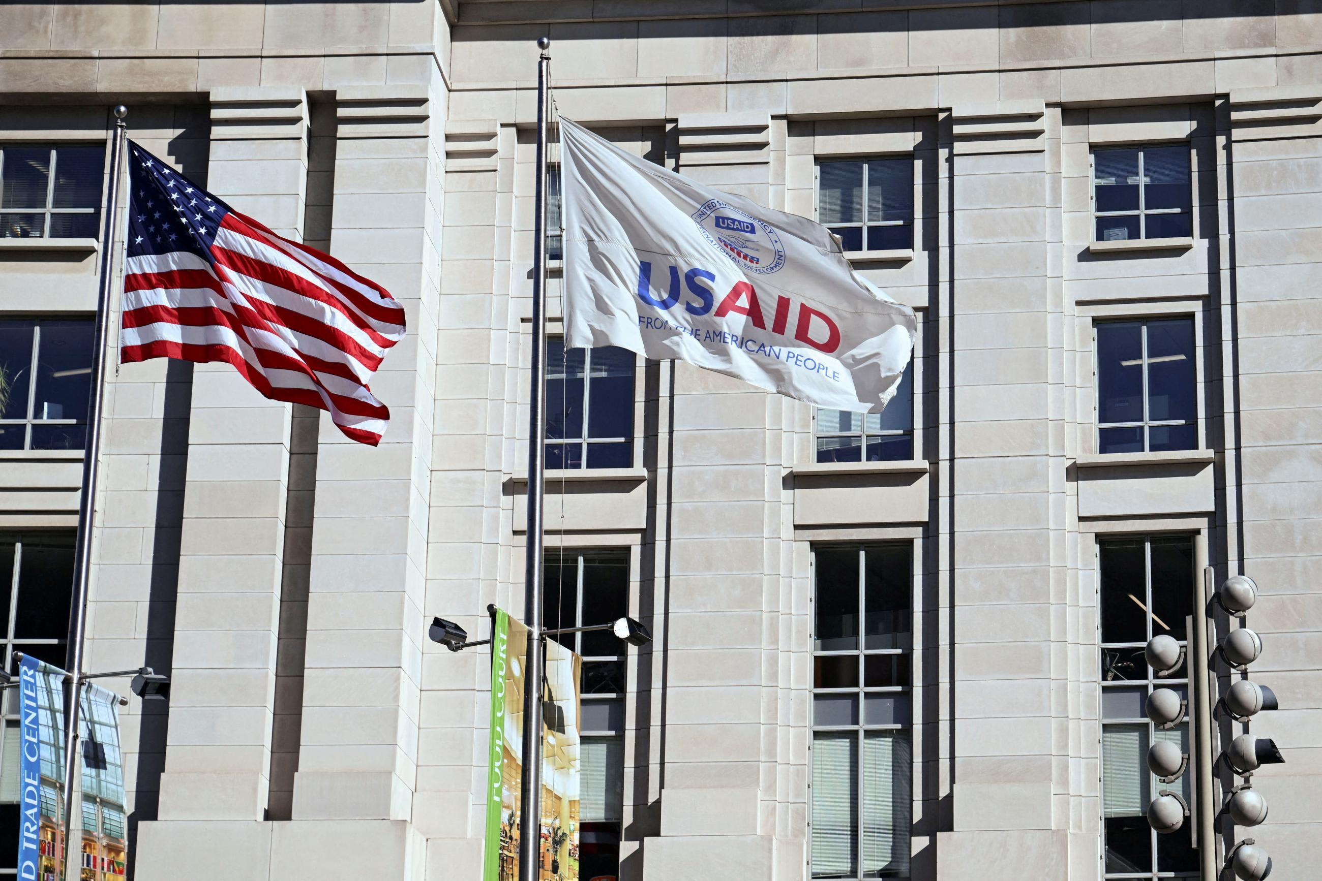 An American flag and&nbsp;USAID&nbsp;flag fly outside the&nbsp;USAID&nbsp;building in Washington, DC,&nbsp;on February 1, 2025.