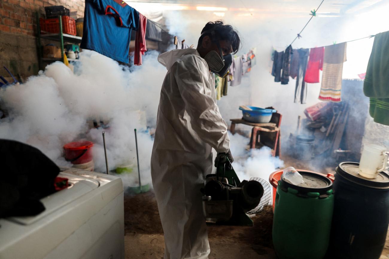 A health worker sprays insecticide to prevent dengue in a house in Lima, Peru, March 7, 2024. Peru recorded some of the worst excess mortality during the COVID-19 pandemic, according to a new study of global life expectancy.
