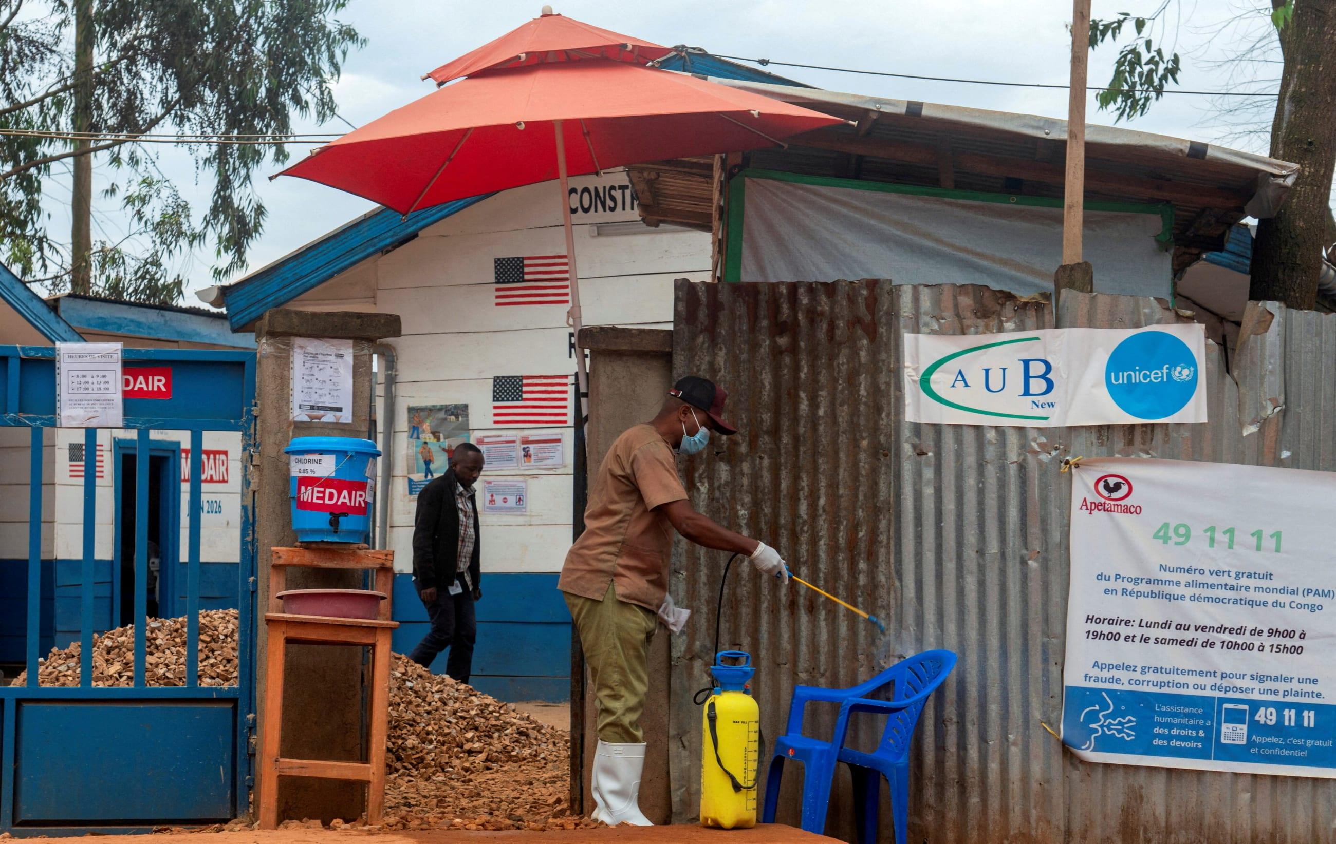 A Congolese hygiene specialist at the Katwa Ebola treatment center disinfects the facility in North Kivu province, Democratic Republic of Congo, on September 10, 2026.
