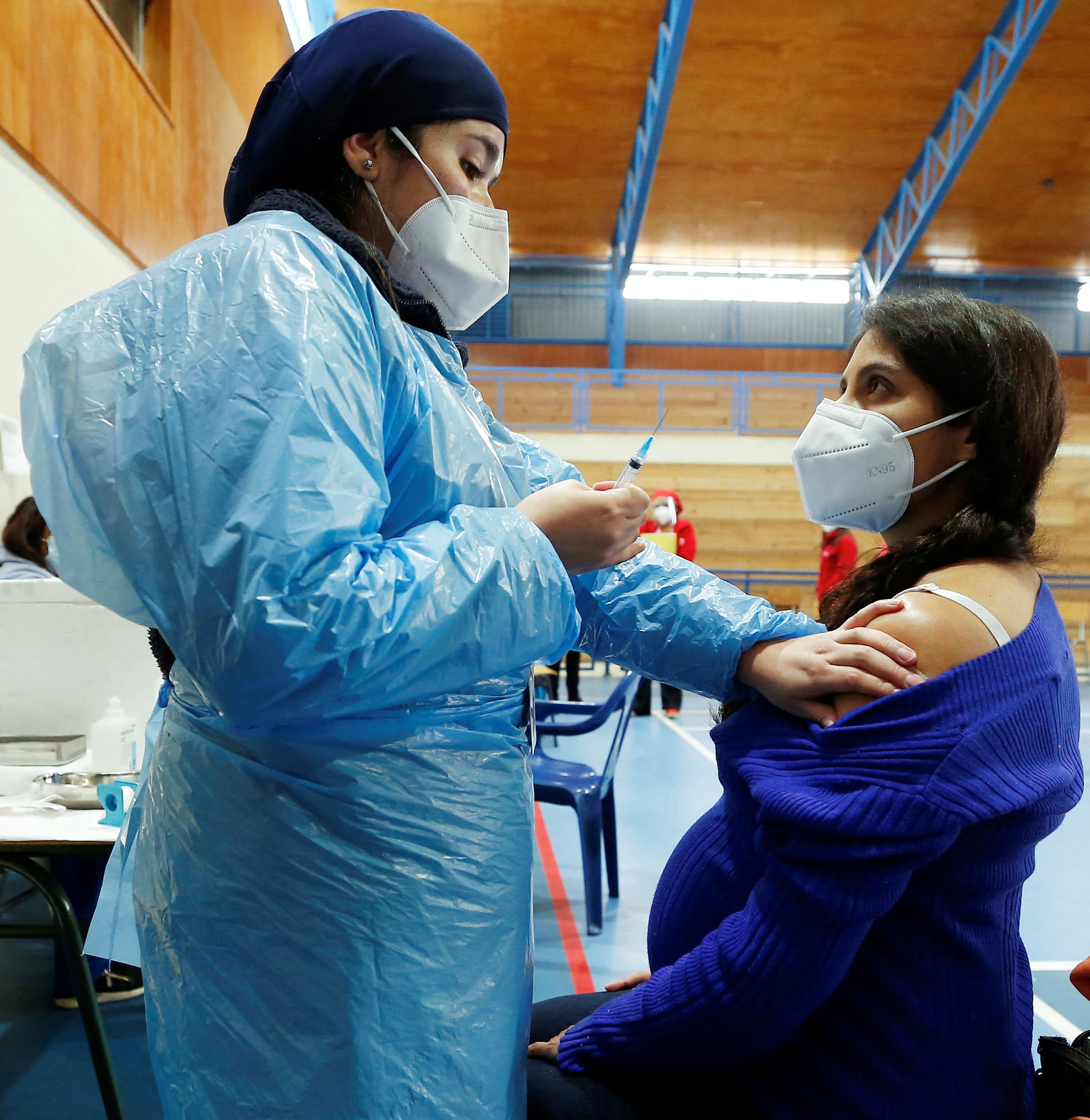 Alyson Bravo receives a dose of Pfizer/BioNTech vaccine at a sport stadium, during the coronavirus disease (COVID-19) pandemic, in Villa Alemana, Chile, on April 28, 2021.