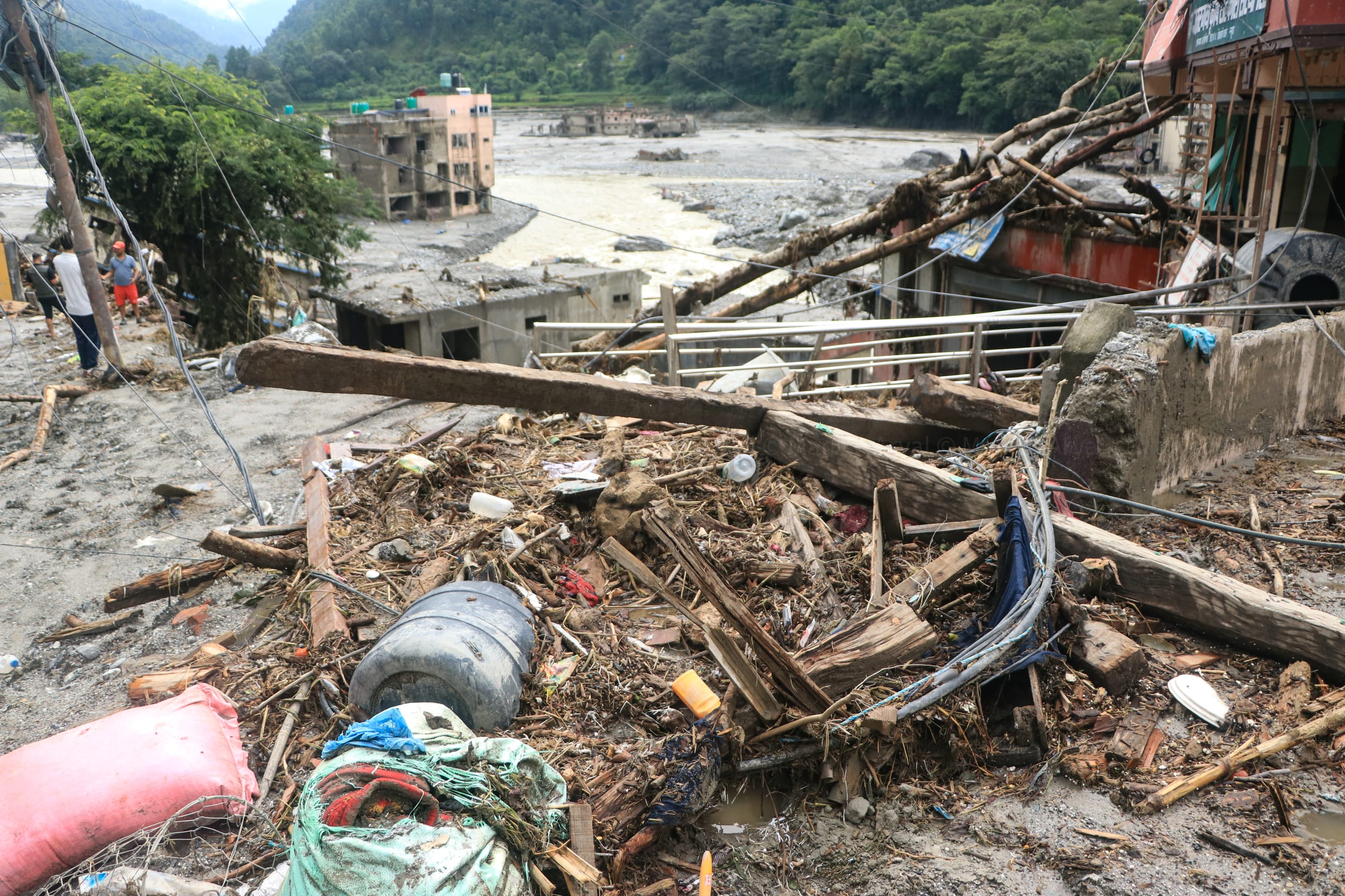 While the search and relief efforts are ongoing, three weeks after flooding wrecked the communities, the house that the flood tore through shows clear signs of destruction, with debris and mud throughout, on August 29, 2026.