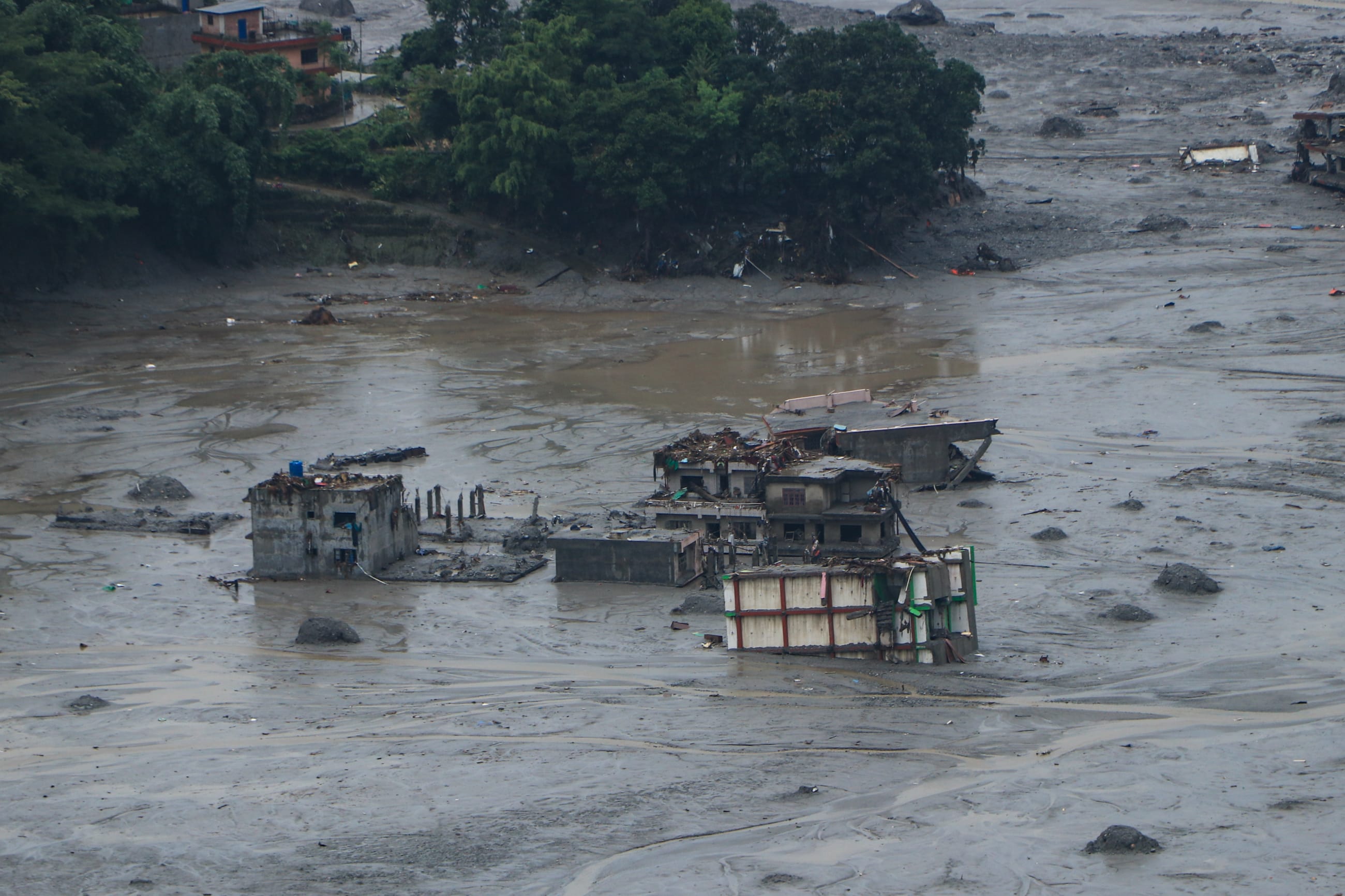 Aftermath of the flood at Betrawati in the Rasuwa district. Only a few homes are standing amid piles of mud and debris. The flood tore through almost everything in its way, including health centers in the region, on August 29, 2026.