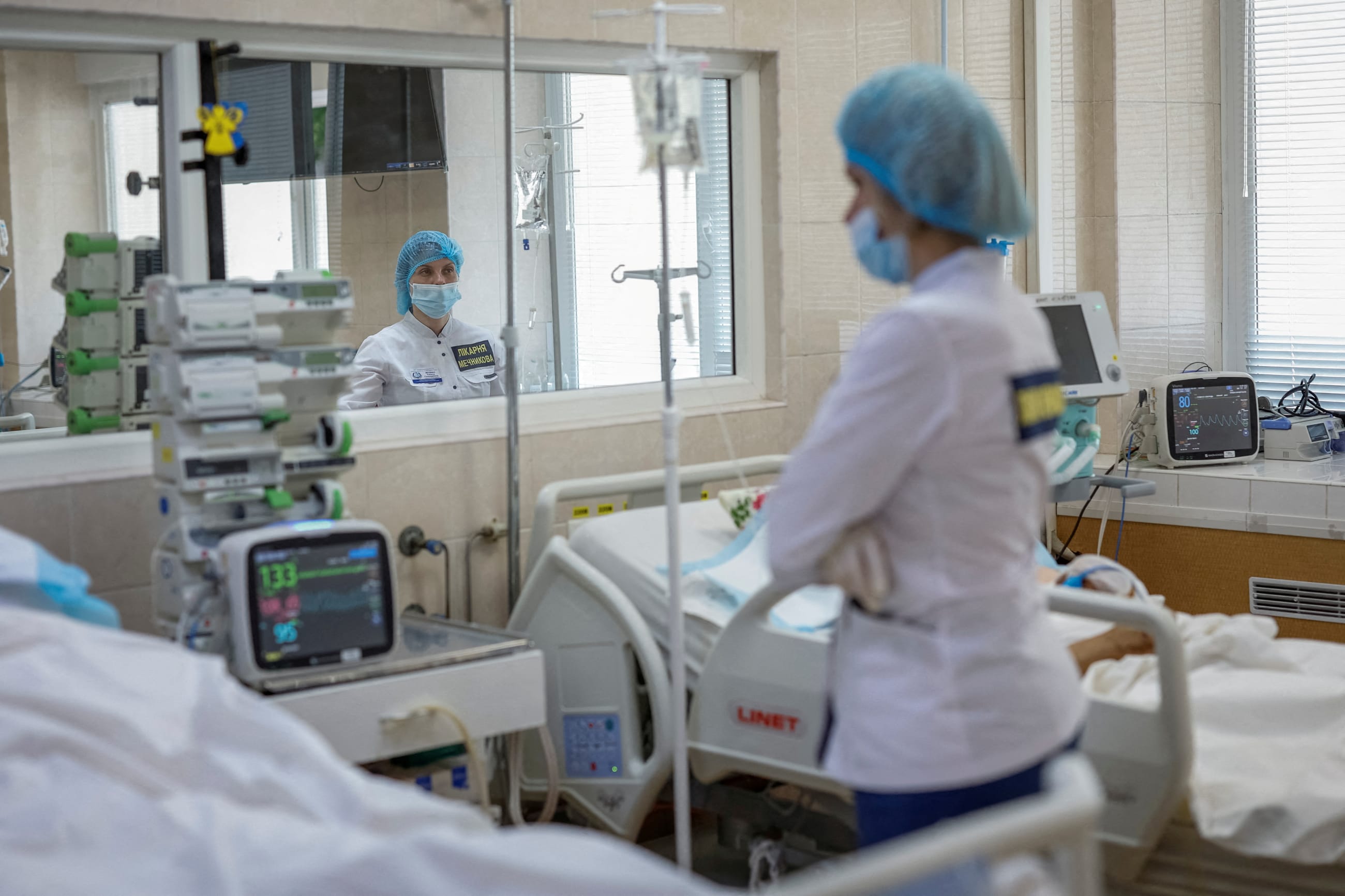 A nurse at the Mechnykov Hospital treats patients in an intensive care unit, amid Russia's attack on Ukraine, in Dnipro, Ukraine, on May 14, 2025.