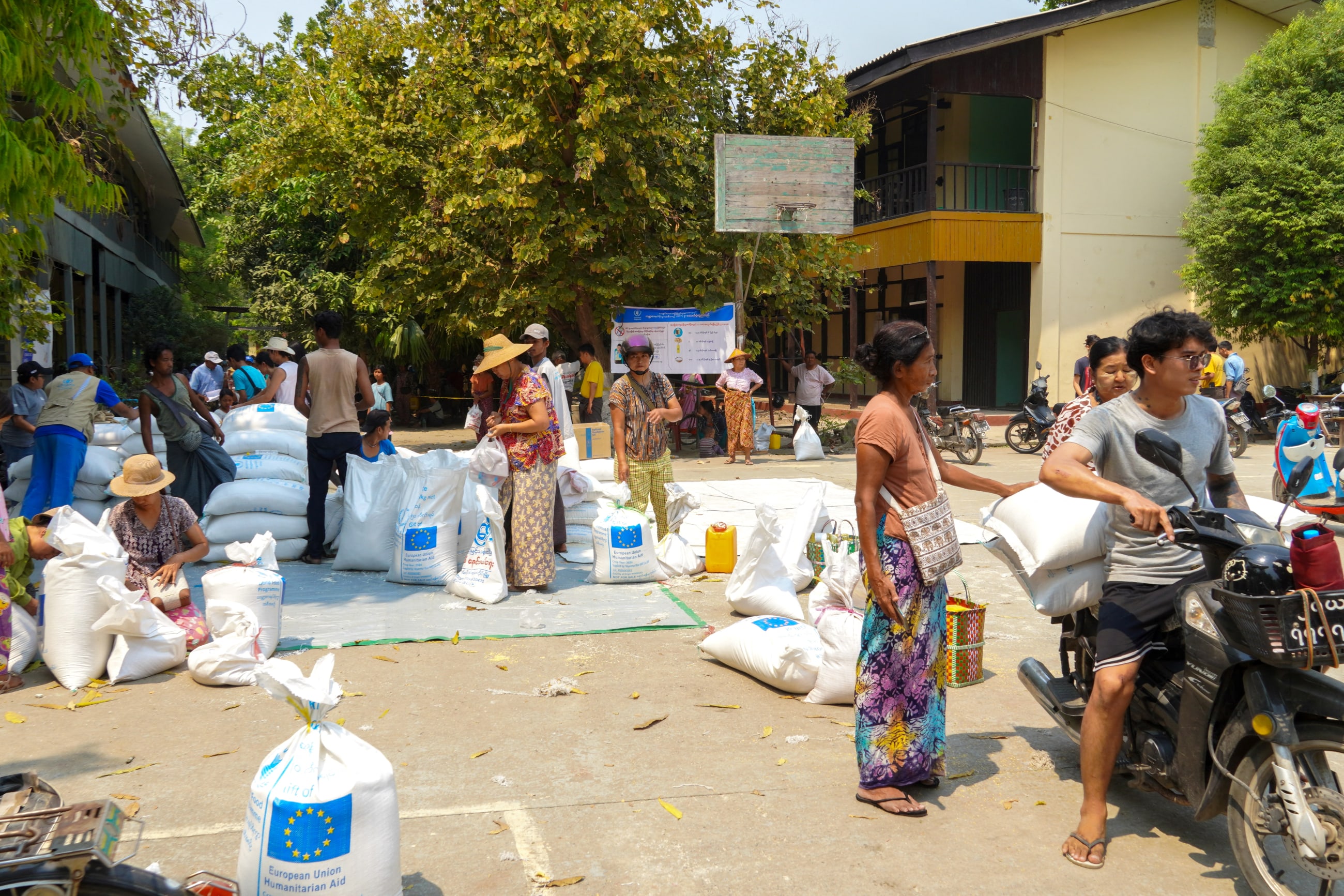 Local residents receive relief supplies inside the compound of Sagaing Hospital, in Sagaing, Myanmar, on April 2, 2025.