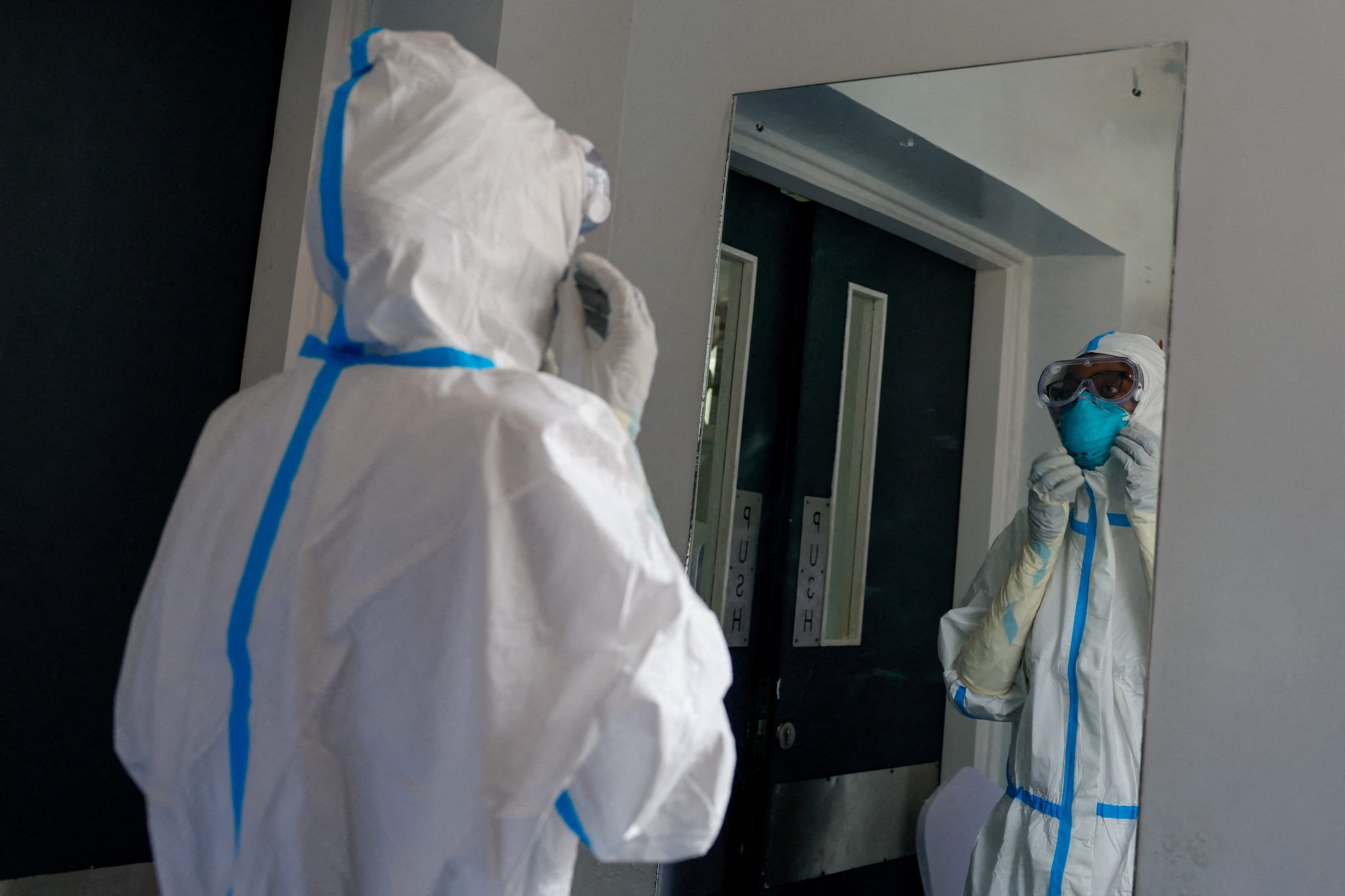 A nurse adjusts a protective mask at Nairobi Hospital, in Nairobi, Kenya, on October 7, 2026.