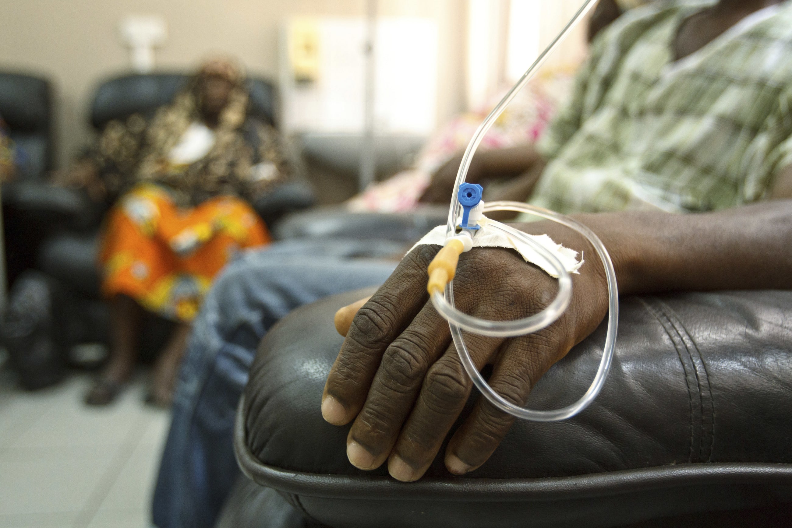 Cancer patients sit in a chemotherapy while receiving treatment at the Korle Bu Teaching Hospital, in Accra, Ghana, on April 24, 2012.