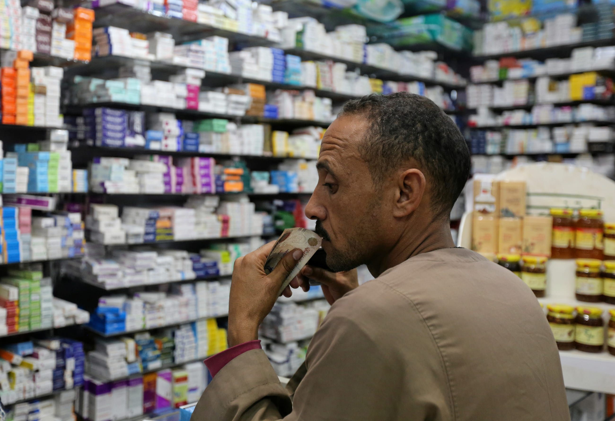 A customer waits for his medicine in a pharmacy, in downtown Cairo, Egypt, on November 17, 2016.