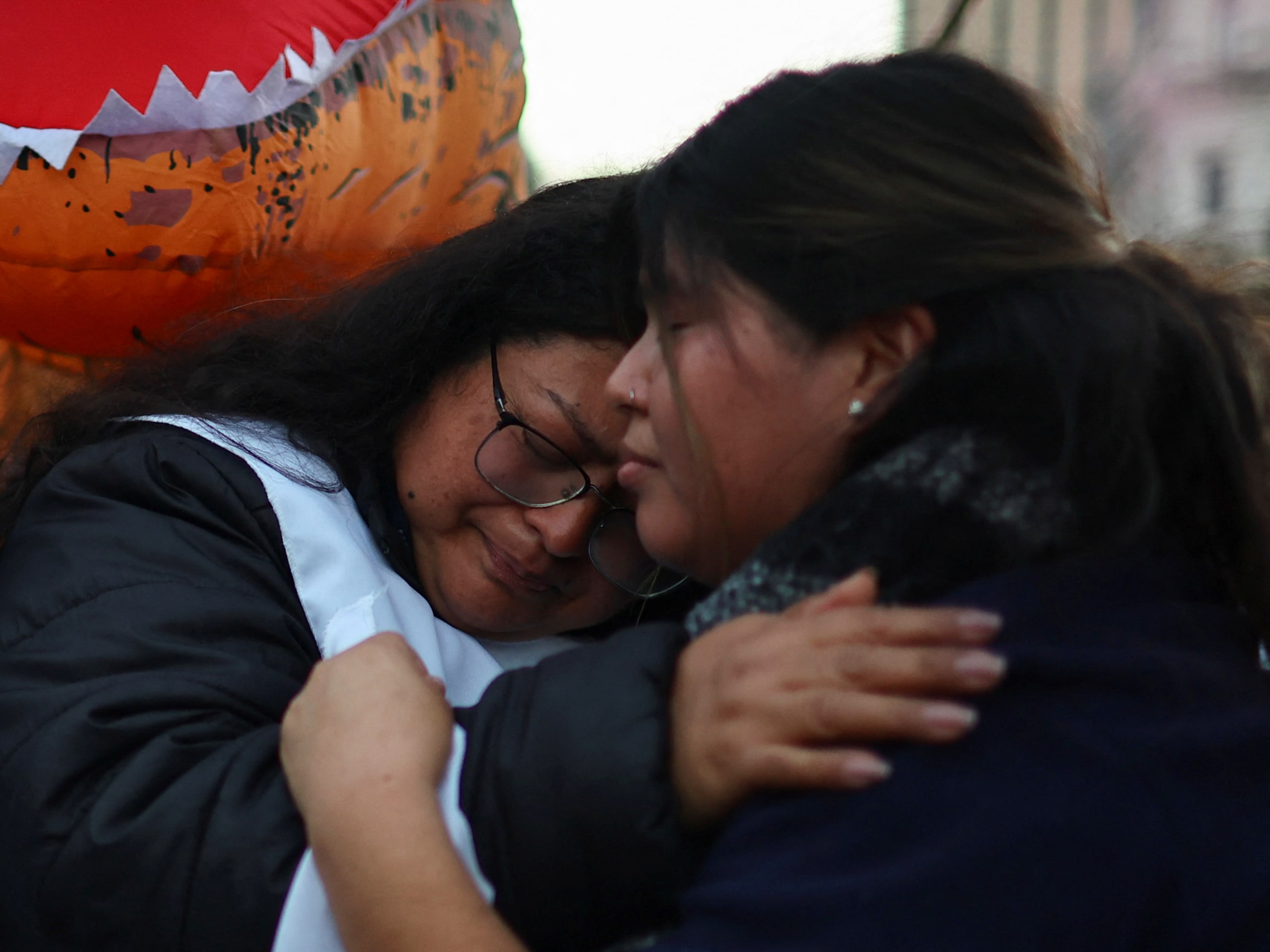 A woman reacts as Argentine health workers and demonstrators march to protest against President Javier Milei's government over underfunding in the health sector and in support of the Garrahan pediatric hospital, in Buenos Aires, Argentina, on July 17, 2025.