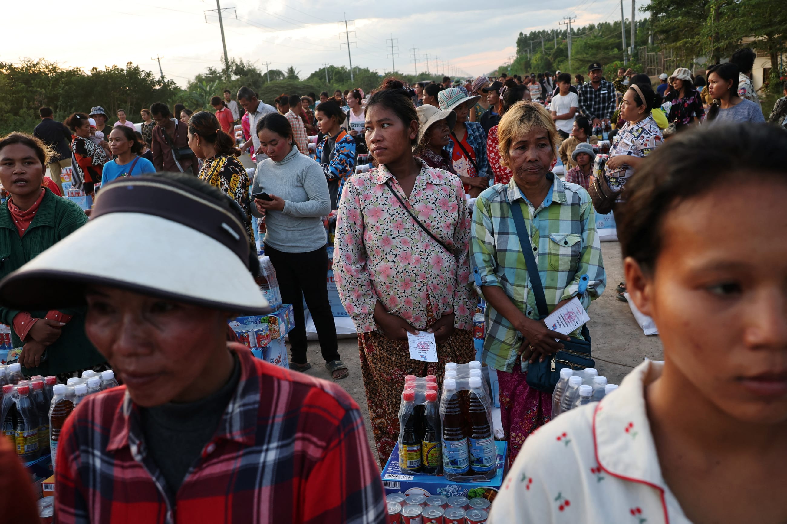 Suang Sreang, 27, who is pregnant and due to give birth within days, waits to receive supplies at Wat Por Sovannaram refugee camp, in Ou Chrov district, Banteay Meanchey Province, Cambodia, on December 13, 2025.