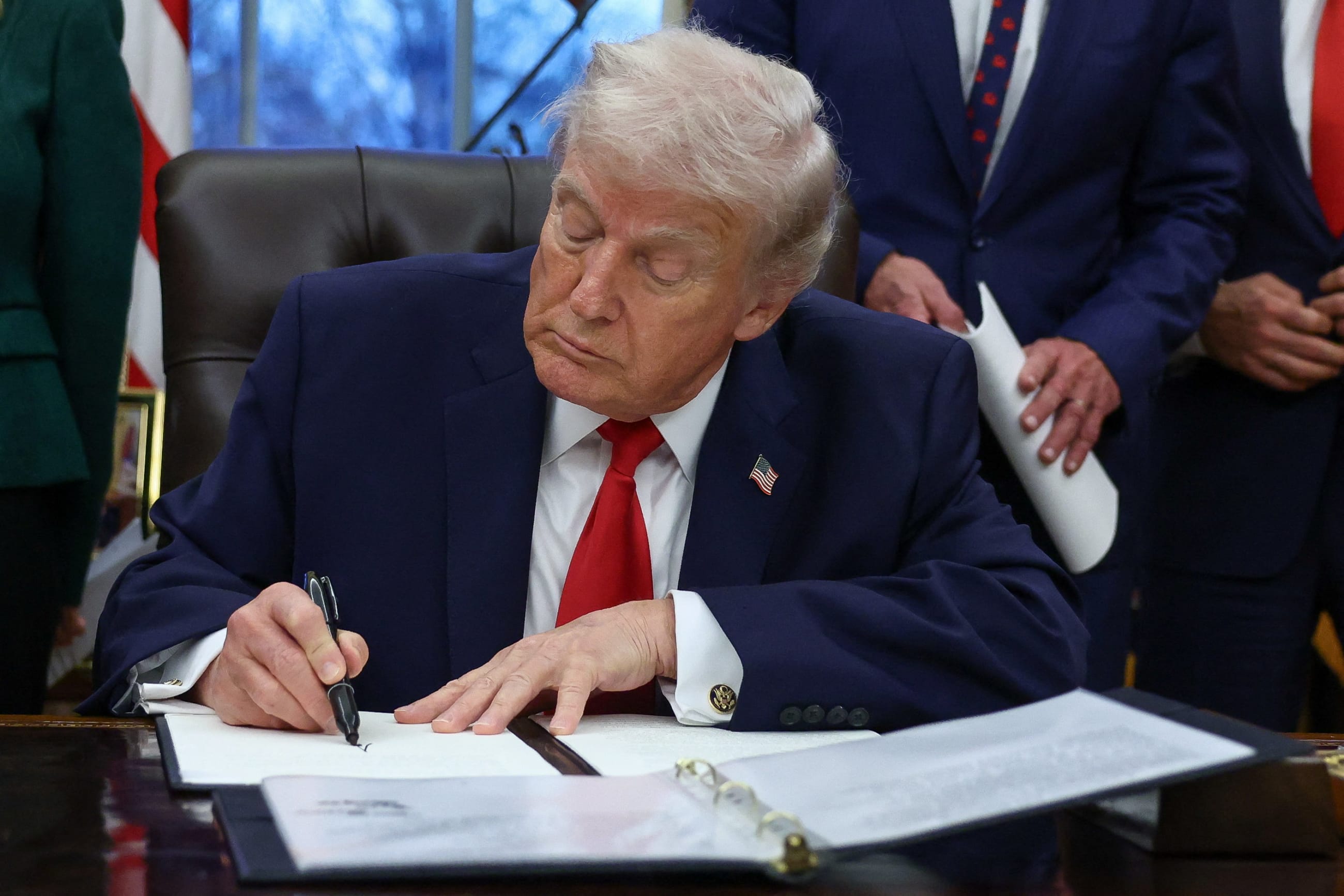 U.S. President Donald Trump signs an executive order for the "Great American Recovery Initiative" to coordinate a federal government response to drug addiction and substance abuse, in Washington, DC, on January 29, 2026.