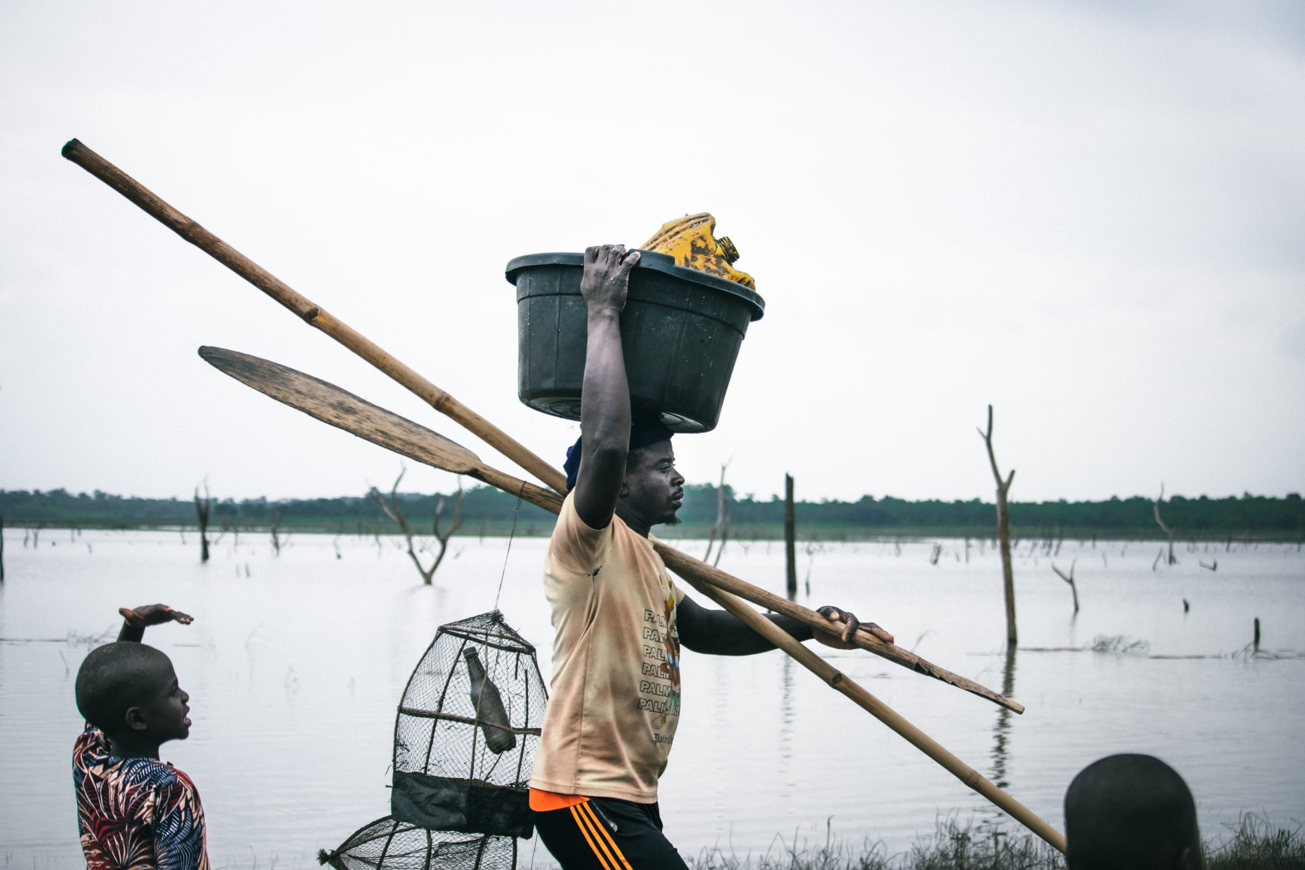 Fishermen are seen at the Oyan River, on July 2025.