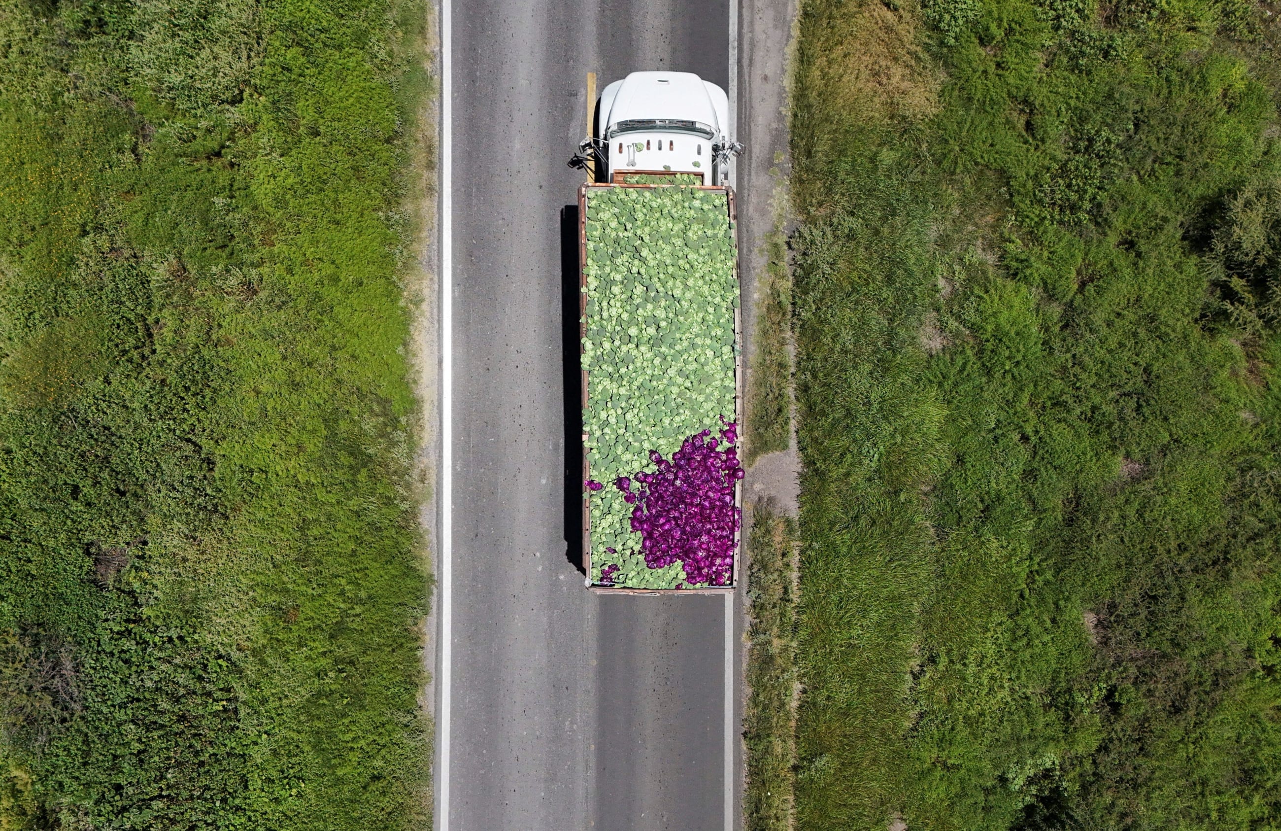 A drone view shows a truck transporting fresh produce after leaving the installations of U.S. supplier Taylor Farms, following the temporary closure announced by Taylor Farms, in Doctor Mora, Guanajuato state, Mexico, on July 24, 2026.