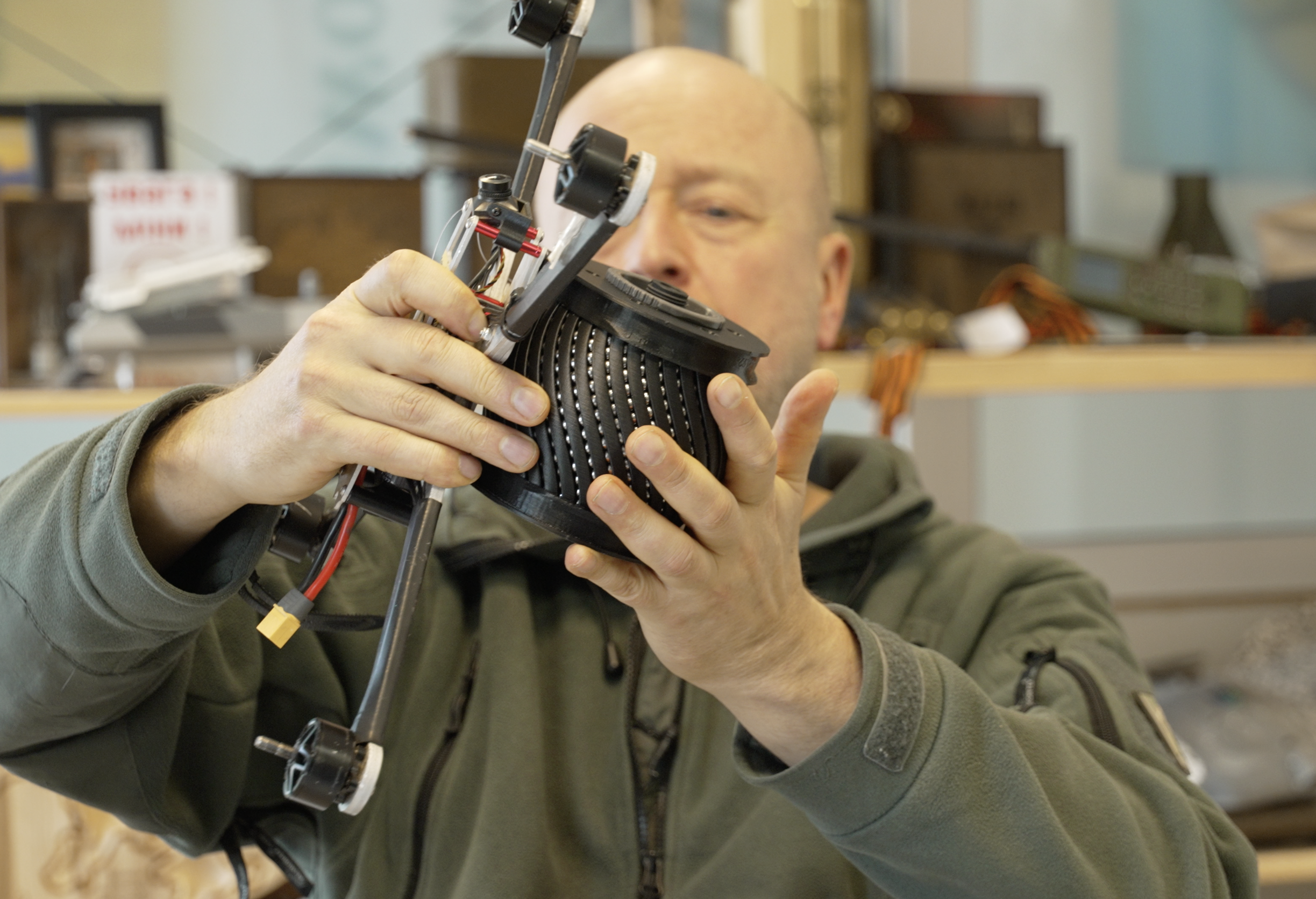 NGO Blue/Yellow co-founder Jonas Ohman puts an inert, drone-carried explosive on a drone at the NGO headquarters in Vilnius, Lithuania, in March 2026.