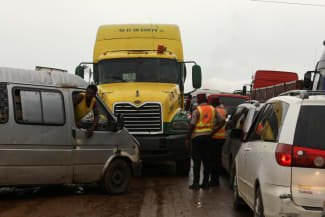 Road safety officers stand, as traffic is blocked up on a road, in Lokoja, Nigeria, on October 13, 2022.