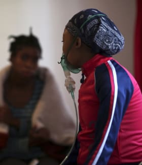 HIV patients chat at Nkosi's Haven, in south of Johannesburg, South Africa, on November 28, 2014.