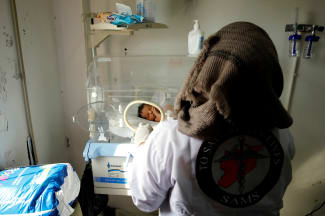A nurse checks a premature baby at a maternity hospital, in Idlib, Syria, on February 27, 2020.