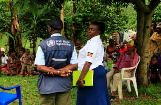 World Health Organization officials and Ugandan health workers inform the community of Kirembo village about the ebola vaccine, in Kasese district, Uganda, on June 15, 2019.