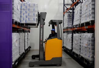 A forklift unloads boxes containing vials of the R21 malaria vaccine inside a cold room at the Serum Institute of India, in Pune, India, on February 27, 2024.
