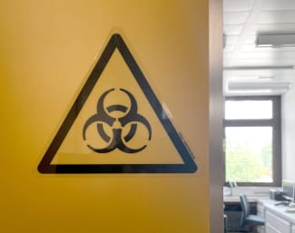 A biohazard sign is displayed in the biocontainment facility of the Spiez Laboratory, in Spiez, Switzerland, on June 8, 2022.