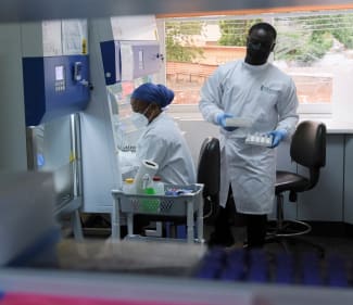Research associates prepare samples at Yemaachi Biotechnology, a cancer research laboratory, in Accra, Ghana, on May 19, 2022.