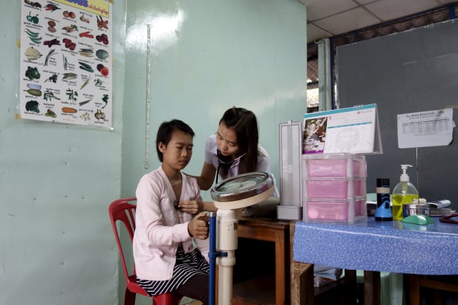 A refugee from Myanmar has her checkup done by a doctor at the Mae Tao clinic, in Mae Sot, Thailand, on October 30, 2015.