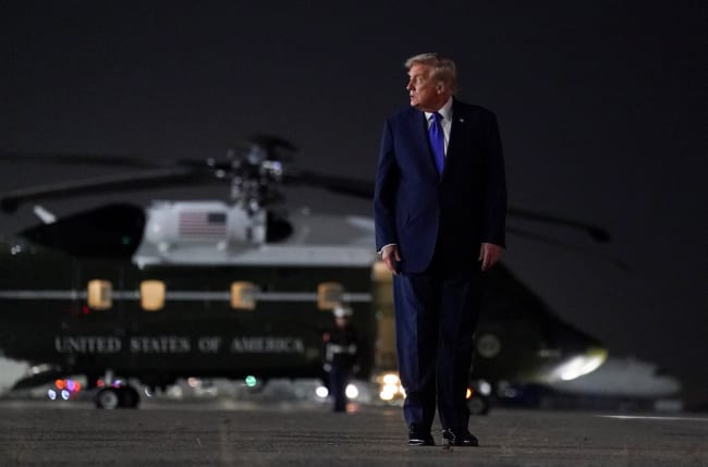 U.S. President Donald Trump looks on as he walks to board Air Force One, after attending the 80th United Nations General Assembly, at John F. Kennedy International Airport, in New York, U.S., September 23, 2025. REUTERS/Al Drago