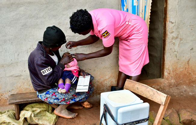 A nurse administers polio vaccine to a child during her community outreach program, in Mushelusi village, in Bulambuli district, Uganda, on September 10, 2025.