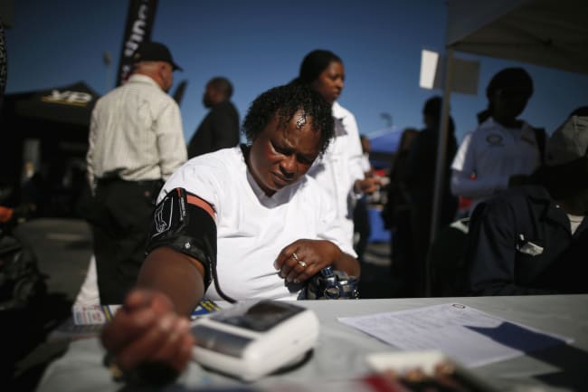 Bernita Jackson, 51, has her blood pressure measured at an event to inform people about the Affordable Care Act, in Los Angeles, California, on November 25, 2013.