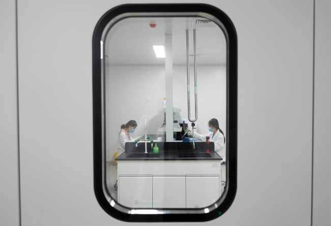 Women work in a laboratory of Chinese vaccine maker Sinovac Biotech, developing an experimental COVID-19 vaccine, during a government-organized media tour, in Beijing, China, on September 24, 2020.