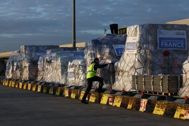 Worldwide Flight Services personnel prepare humanitarian aid packages for the first French humanitarian flight to Beirut, carrying 60 tons of relief supplies and pharmaceutical products, at Paris‑Charles de Gaulle Airport, in Roissy‑en‑France near Paris, France, on March 12, 2026.