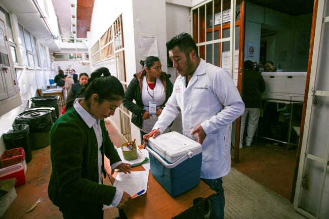 Community health workers prepare vaccines for a measles vaccination drive amid a surge in cases, in San Cristobal de Las Casas, Chiapas, Mexico, on February 25, 2026.