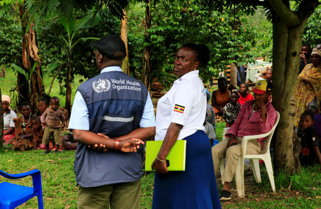 World Health Organization officials and Ugandan health workers inform the community of Kirembo village about the ebola vaccine, in Kasese district, Uganda, on June 15, 2019.