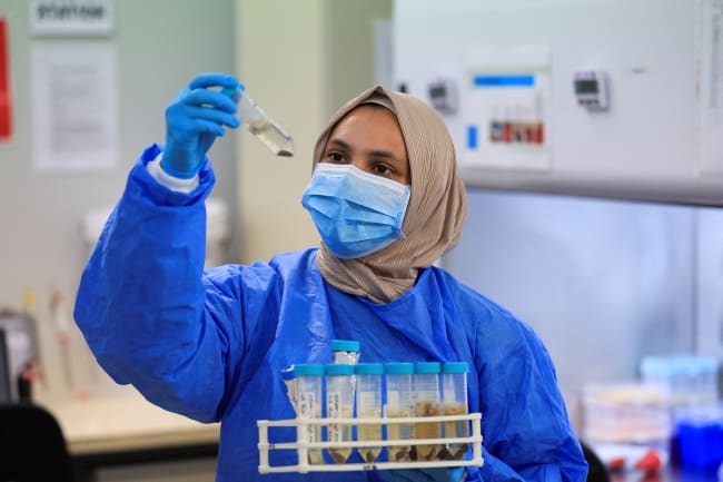 A scientific officer works in the research lab at the University of Cape Town's Institute of Infectious Disease and Molecular Medicine, in Cape Town, South Africa, on February 17, 2025.