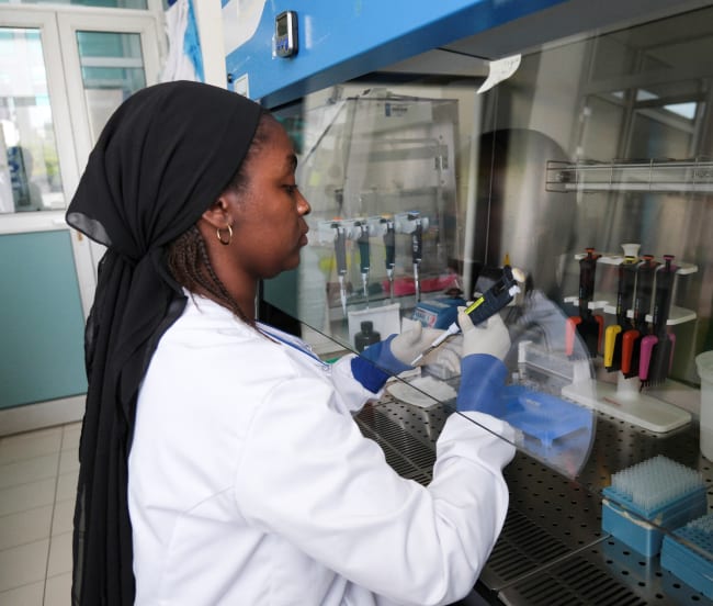 Seynabou Diop works at a station in a laboratory where the hantavirus genome was sequenced at Institut Pasteur, in Dakar, Senegal, on May 19, 2026.