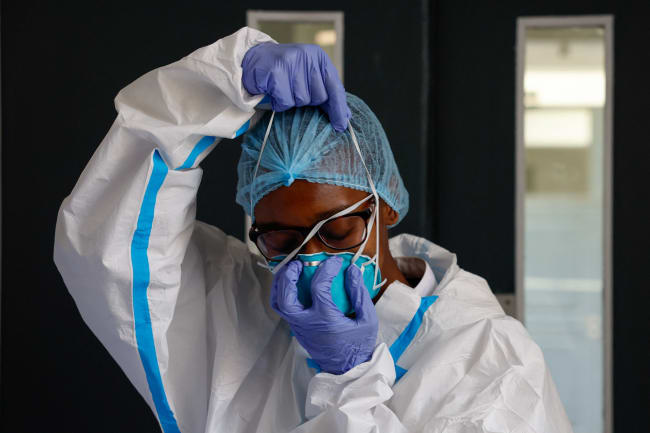 A nurse puts on a protective mask, at Nairobi Hospital, in Nairobi, Kenya, on October 7, 2026.