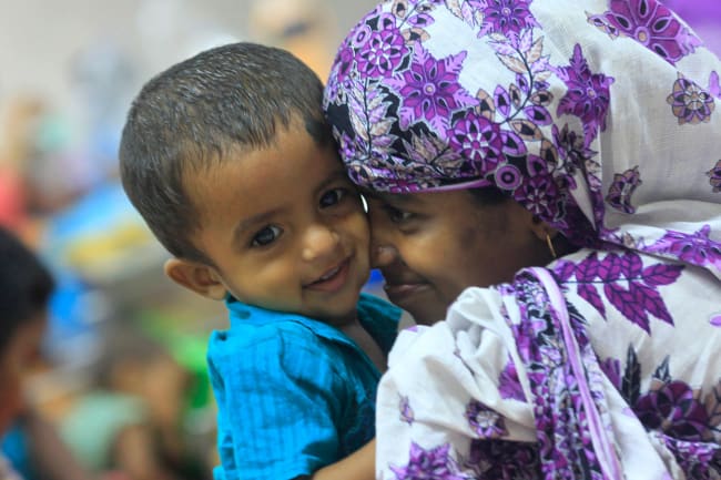 A mother plays with her thirteen-month old child Neerob, who is suffering from diarrhoea, at the International Centre for Diarrhoeal Disease & Research (ICDDRB), in Dhaka April 6, 2012.
