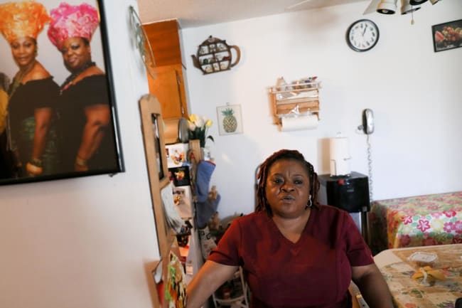 Deferred Enforced Departure status holder Marie Zar, who works as a nurse's assistant, gets ready for work, in Brooklyn Center, Minnesota, on March 29, 2019.