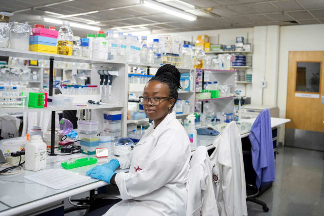 A medical laboratory technician at the Wits Antiviral Gene Therapy Research Unit poses for a portrait, in the research lab at the Wits University Faculty of Health Sciences, in Johannesburg, South Africa, on February 14, 2025.