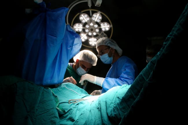 Medical personnel work in an operating room at Nasser Hospital, in Khan Younis in the southern Gaza Strip, on July 9, 2025.