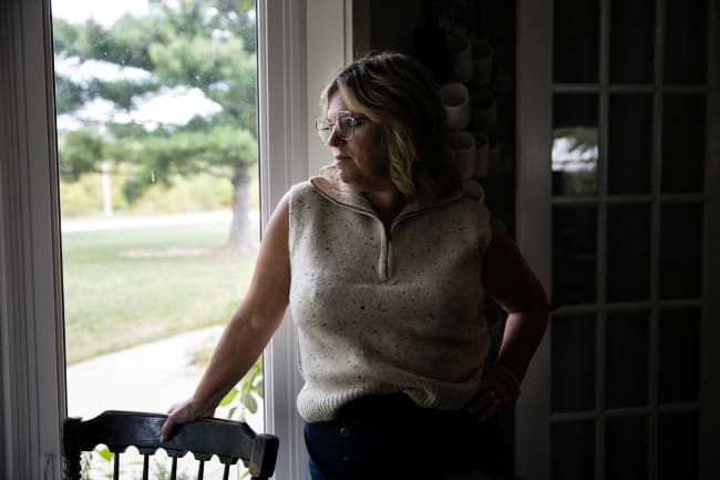 Dawn Heidlebaugh, who experienced mental health concerns while using Ozempic, looks out of the window of her home, in Findlay, Ohio, on September 19, 2023.