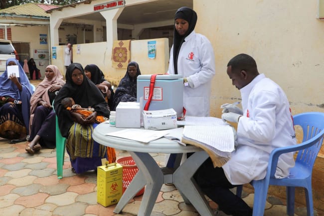 A nurse from Save the Children prepares vaccinations for internally displaced Somali children, in Baidoa, Somalia, on June 25, 2025.